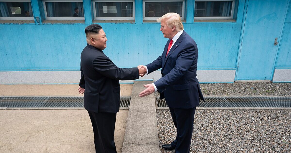 Kim Jong-un and Donald Trump shake hands during their historic meeting at the Korean Demilitarized Zone, symbolizing a step towards diplomatic relations.