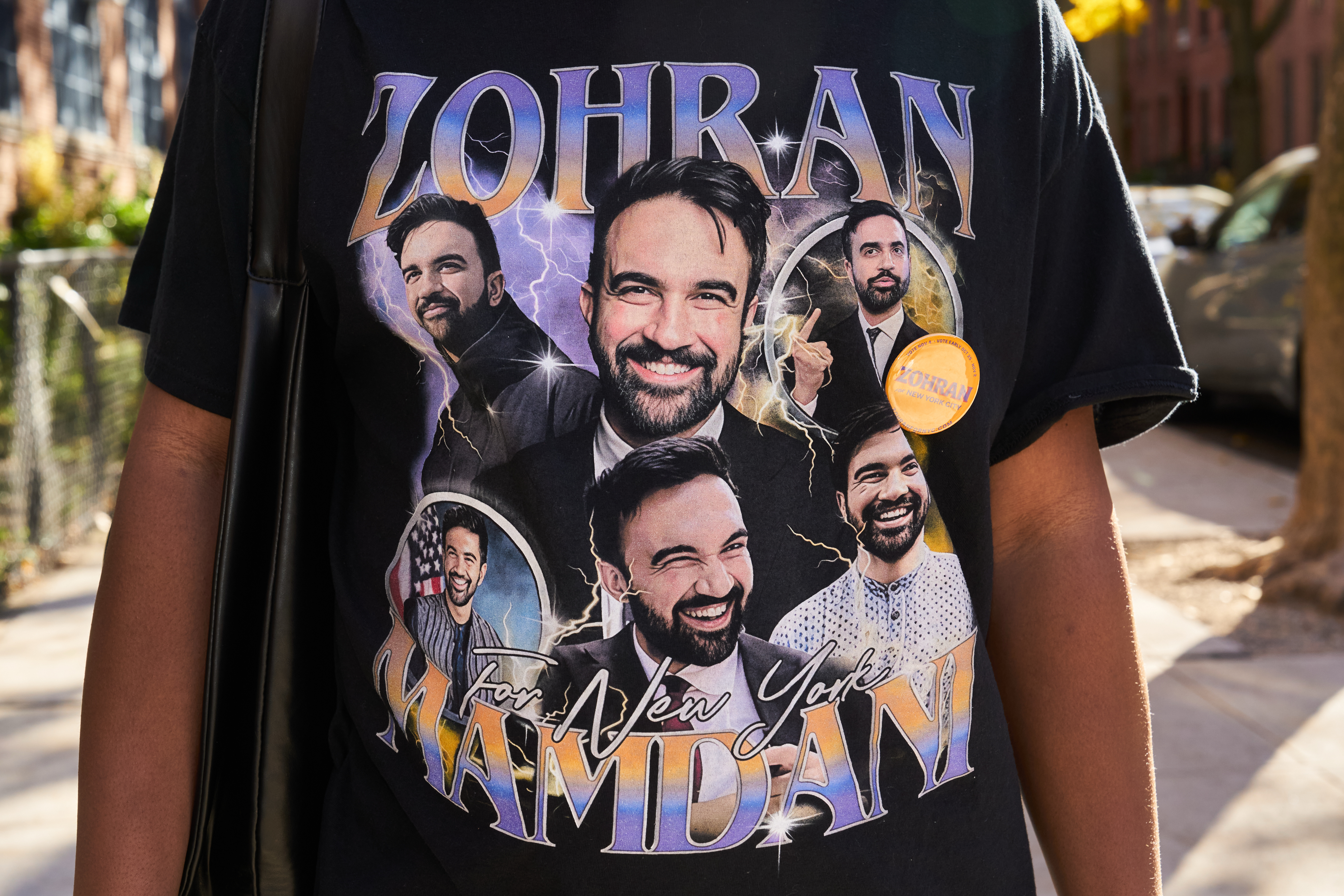 Michael Morris, a former New Yorker visiting from Boston, wears a T-shirt depicting Zohran Mamdani outside of a polling site in the Clinton Hill neighborhood of Brooklyn, New York, Nov. 4, 2025.