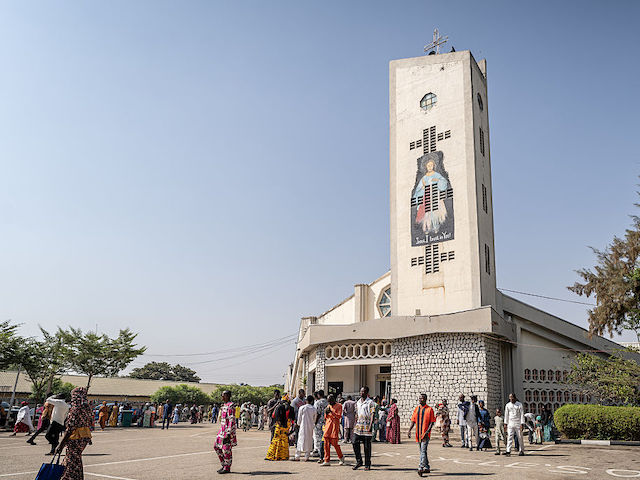 Catholics leave the Saint Michael's Cathedral at the end of the Sunday's service in Minna on November 30, 2025 as the congregatipon prayed for the safe return of the abducted students of Saint Mary's Catholic School earlier this month. (Photo by Light Oriye Tamunotonye / AFP)