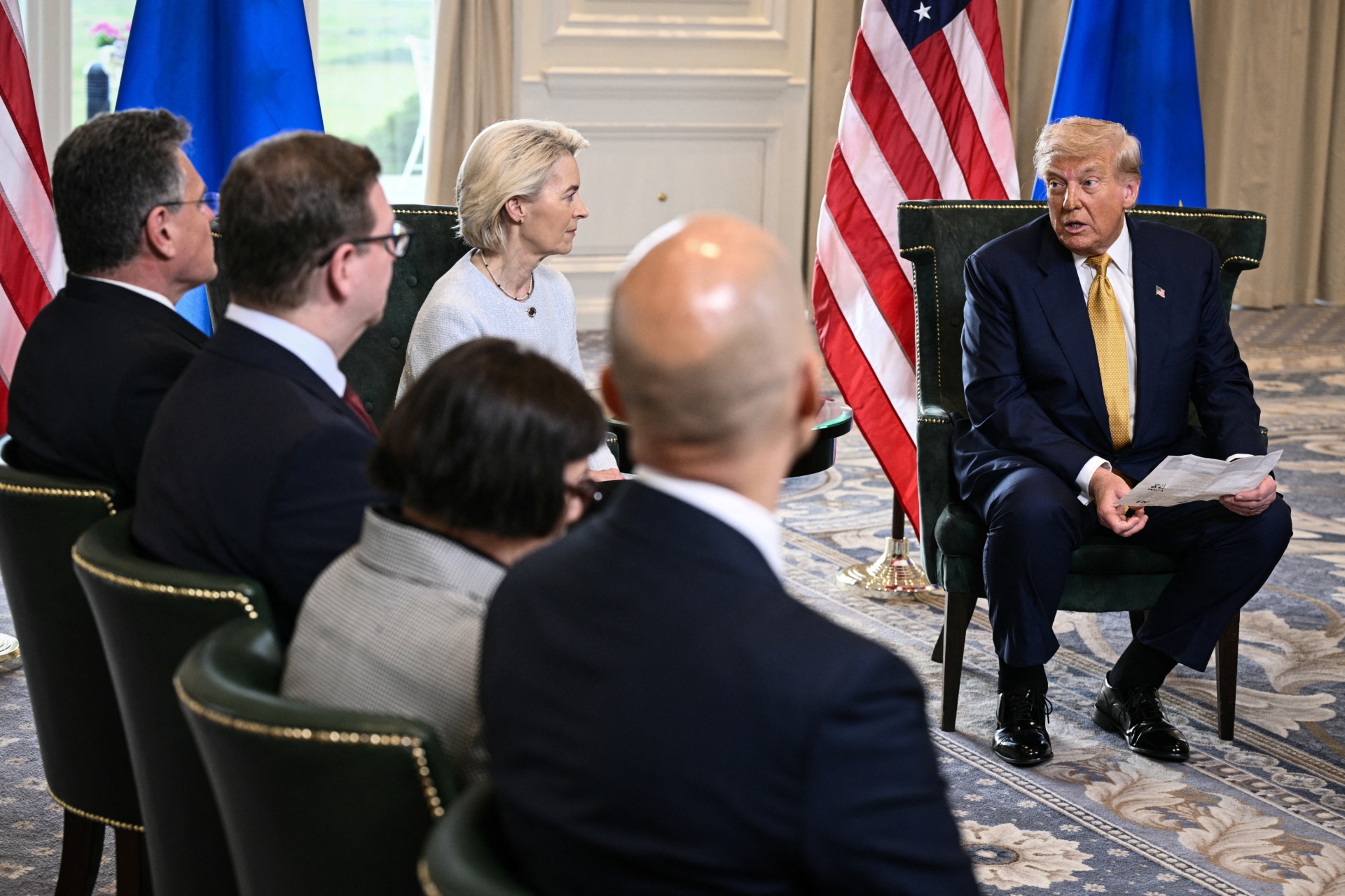 US President Donald Trump (R) and European Commission President Ursula von der Leyen (2nd R) speak to the press after agreeing on a trade deal between the two economies following their meeting, in Turnberry south west Scotland on July 27, 2025, on the third day of his visit to the country, since his second tenure as President began. US President Donald Trump said on July 27, 2025 that he had reached a trade agreement with European Union chief Ursula von der Leyen. "We have reached a deal. It's a good deal for everybody," Trump told reporters after talks with von der Leyen at his golf resort in Turnberry, Scotland. The EU chief also hailed it as a "good deal". (Photo by Brendan SMIALOWSKI / AFP) (Photo by BRENDAN SMIALOWSKI/AFP via Getty Images)