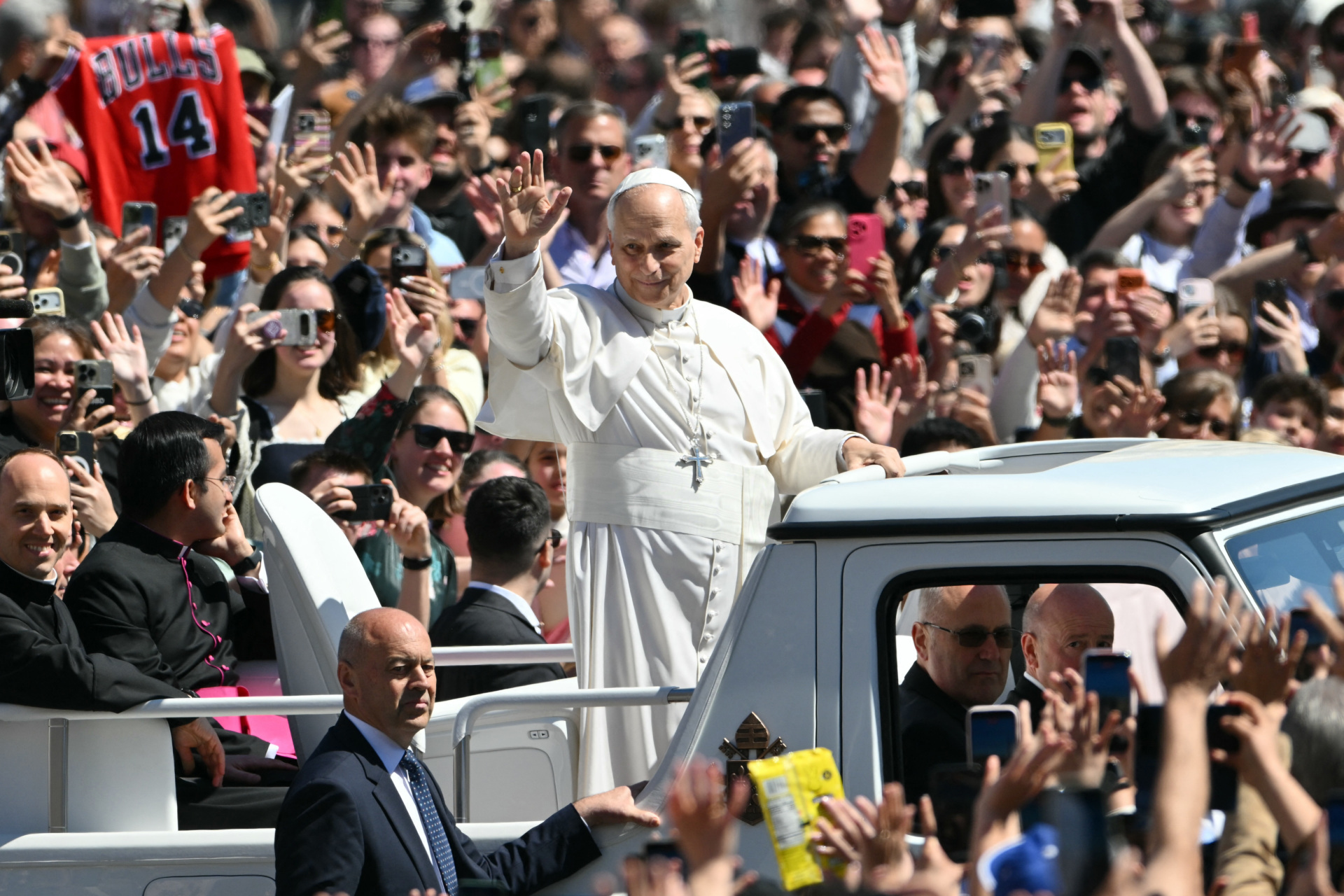 Pope Leo XIV waves to the crowd from the popemobile after the Easter Mass as part of the Holy Week celebrations, at St Peter's square in the Vatican on April 5, 2026. (Photo by Alberto PIZZOLI / AFP via Getty Images)
