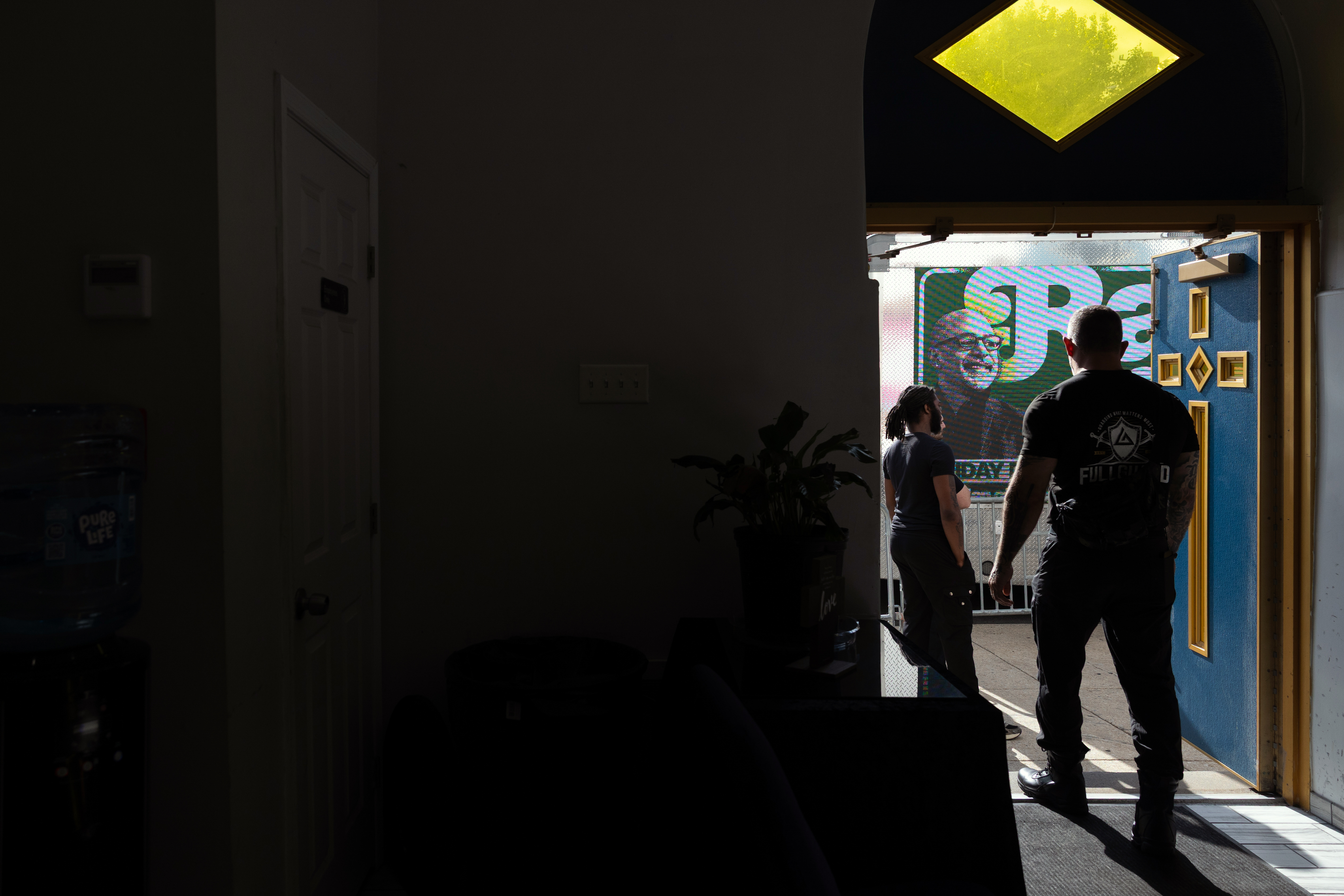 Security is seen at a rally for Rabb in Philadelphia, on May 15, 2026.