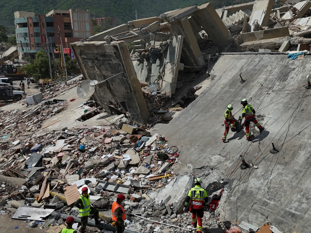 Mexican Army rescue workers search for people trapped in collapsed buildings after earthquakes struck La Guaira, Venezuela, Sunday, June 28, 2026. (AP Photo/Matias Delacroix)
