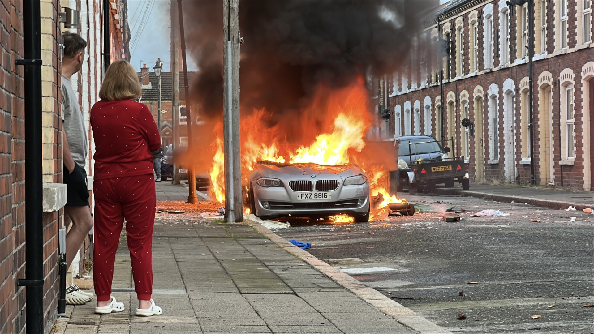 Vehicles set on fire by protesters on McMaster Street in east Belfast, as disorder flared during an anti-immigration demonstration organised in response to Monday night's stabbing attack in the city. A 30 year-old man arrested in connection with the Belfast stabbing attack has been charged with attempted murder and will appear in court in the city on Wednesday, the Police Service of Northern Ireland has said. Picture date: Tuesday June 9, 2026. (Photo by PA/PA Images via Getty Images)