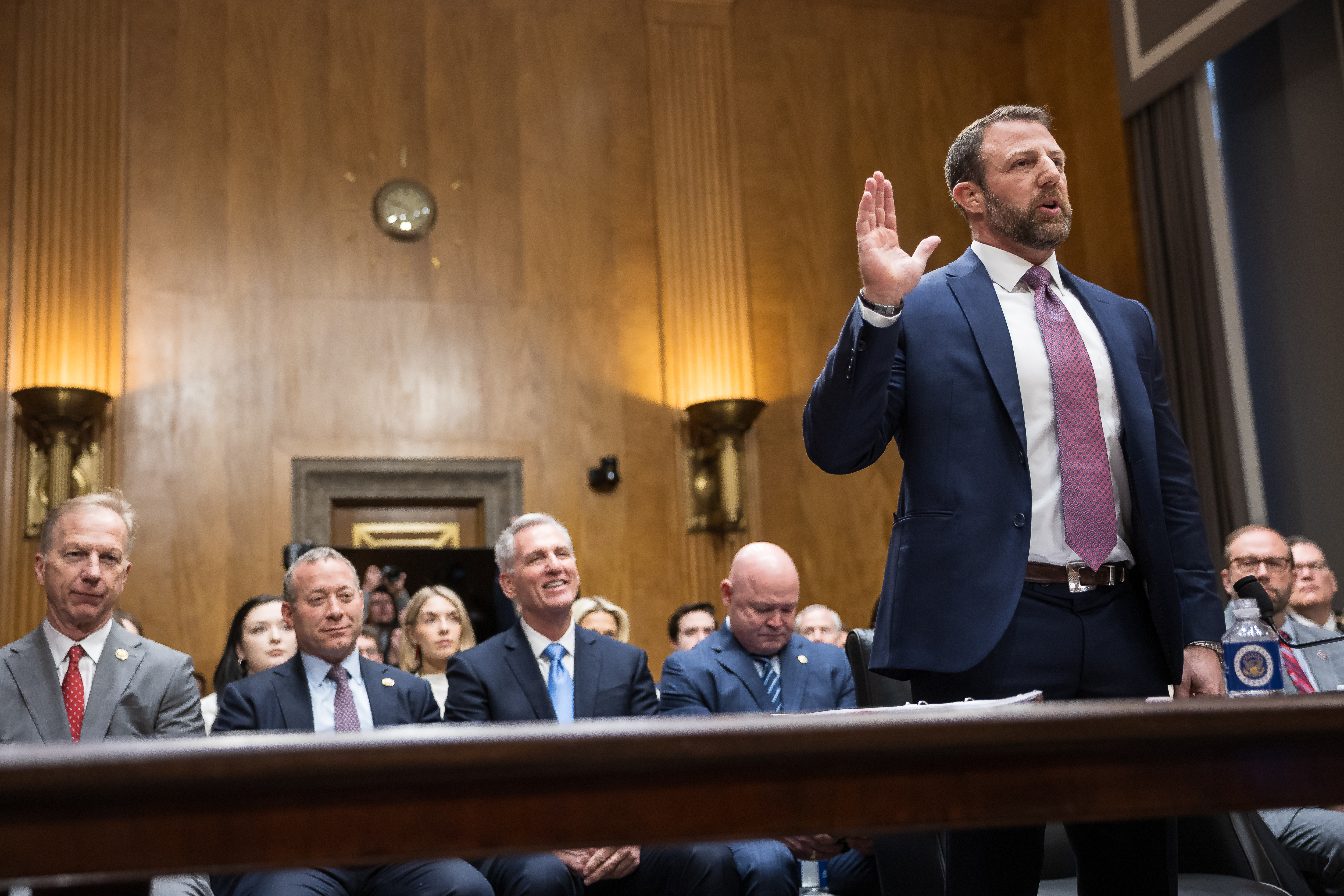 Gottheimer, second from left, is seen in the audience as Markwayne Mullin is sworn in to testify before the Senate Homeland Security Committee on Capitol Hill in Washington, on March 18, 2026.