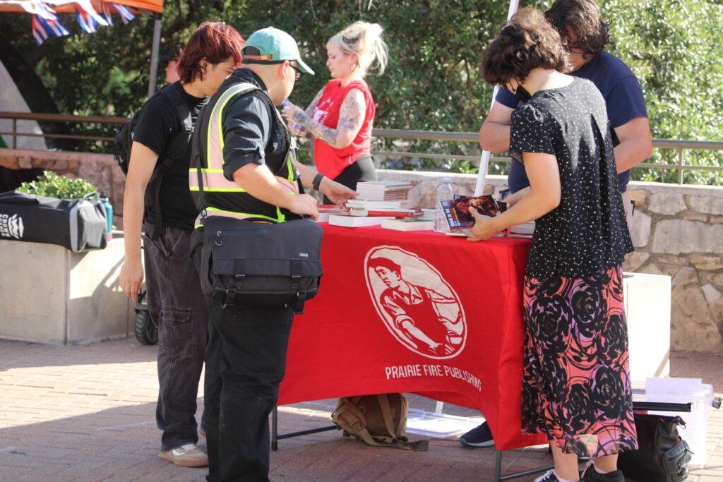Socialists offer up communist literature at PSL Pro CUBA protest (Randy Clark/Breitbart Texas)