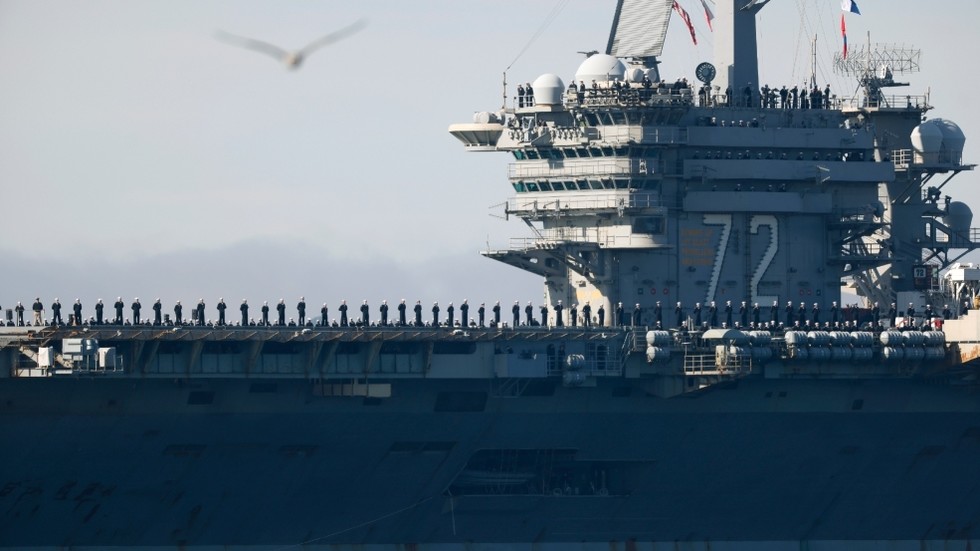 Burned-out US aircraft carrier sailors near Iran tried to jump overboard – media