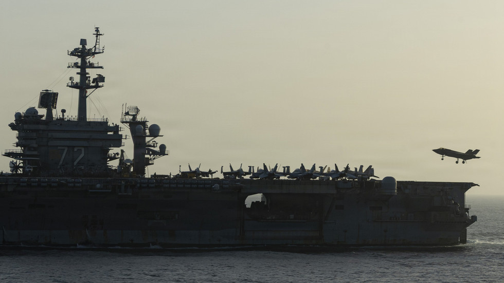 Troubled US aircraft carrier heads home after protracted deployment – media