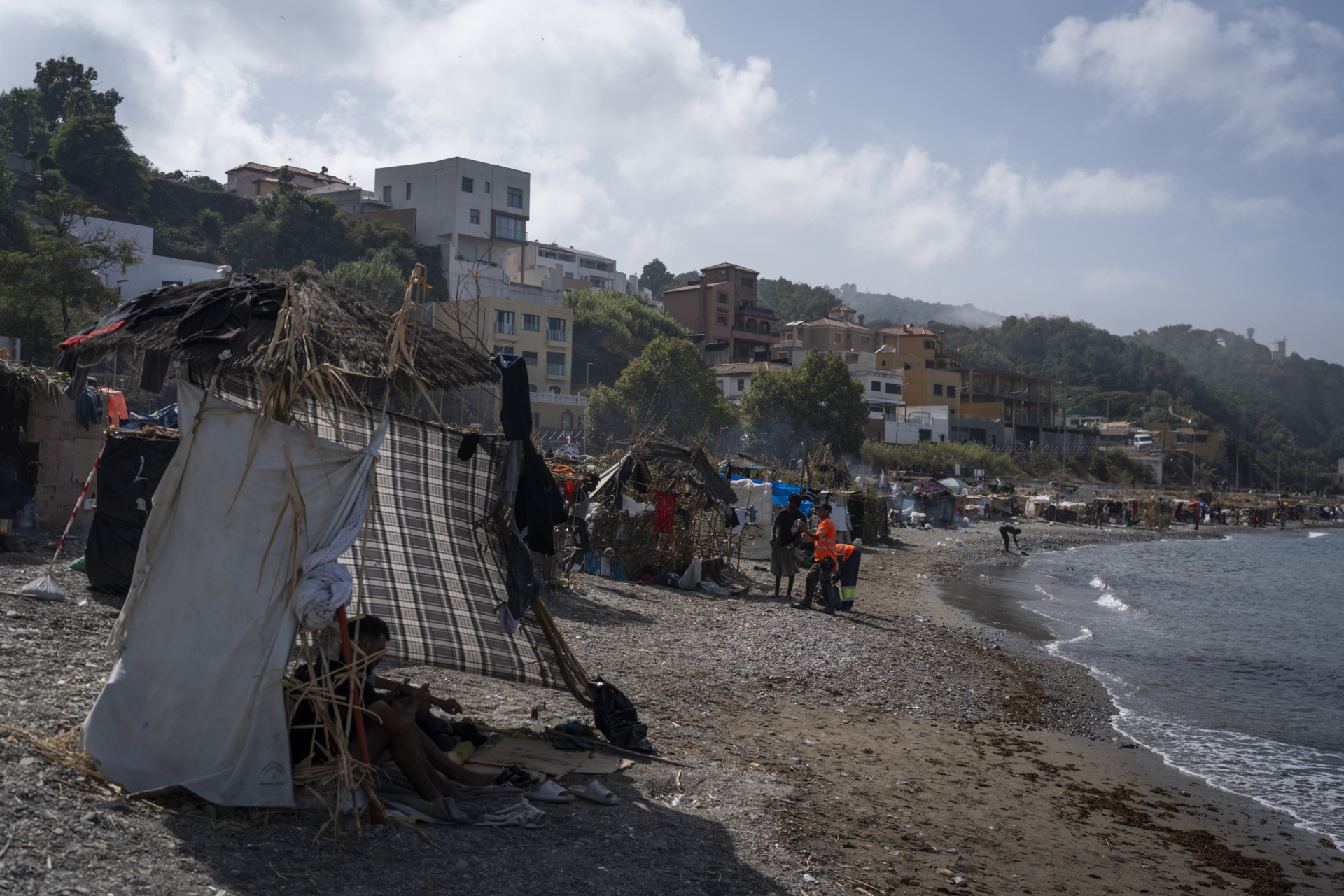 CEUTA, SPAIN - AUGUST 14: Migrants are seen in an improvised shanty camp in El Trampolin Beach on August 14, 2026 in Ceuta, Spain. Fears of a second surge of migrant crossings into the Spanish North African exclave of Ceuta have intensified following anonymous social media calls and false online rumours claiming that the border with Morocco will open. This follows the crisis in late July where tens of thousands rushed the border due to misinformation surrounding a Spanish court ruling. One hundred deaths occurred as a result of 78000 migrants crossing from neighbouring Morocco. (Photo by Adri Salido/Getty Images)