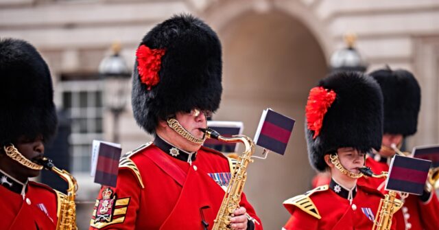 Watch: Dolly Parton, the Queen of Country, Saluted at Buckingham Palace