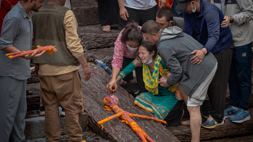 Nepal rescuers delayed by mud and water in tunnels – PM
