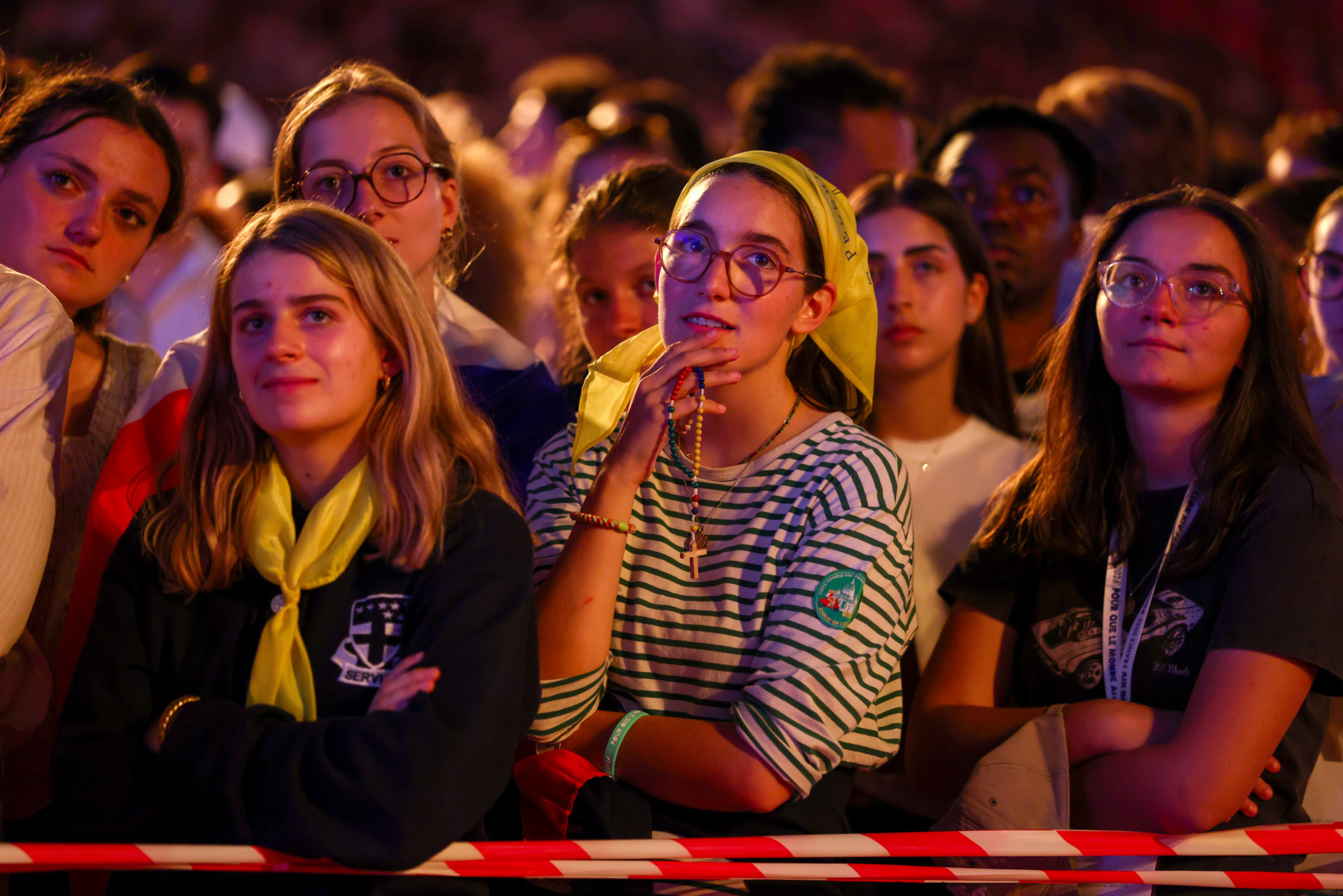 PARIS, FRANCE - SEPTEMBER 25: Youth attend a concert as part of a prayer vigil with young people led by Pope Leo XIV at the Stade de France on September 25 in Saint-Denis, a northern suburb of Paris, France. Pope Leo XIV is making his first official visit to France from September 25-28 with stops in Paris, Lourdes, and Metz. While in Paris, the pontiff's agenda includes a meeting with French President Emmanuel Macron, a prayer service at Notre-Dame Cathedral, and an open-air mass along the Champs-Élysées, among other engagements. The trip marks the first papal visit to the European country since Benedict XVI visited in 2008. (Photo by Tom Nicholson/Getty Images)