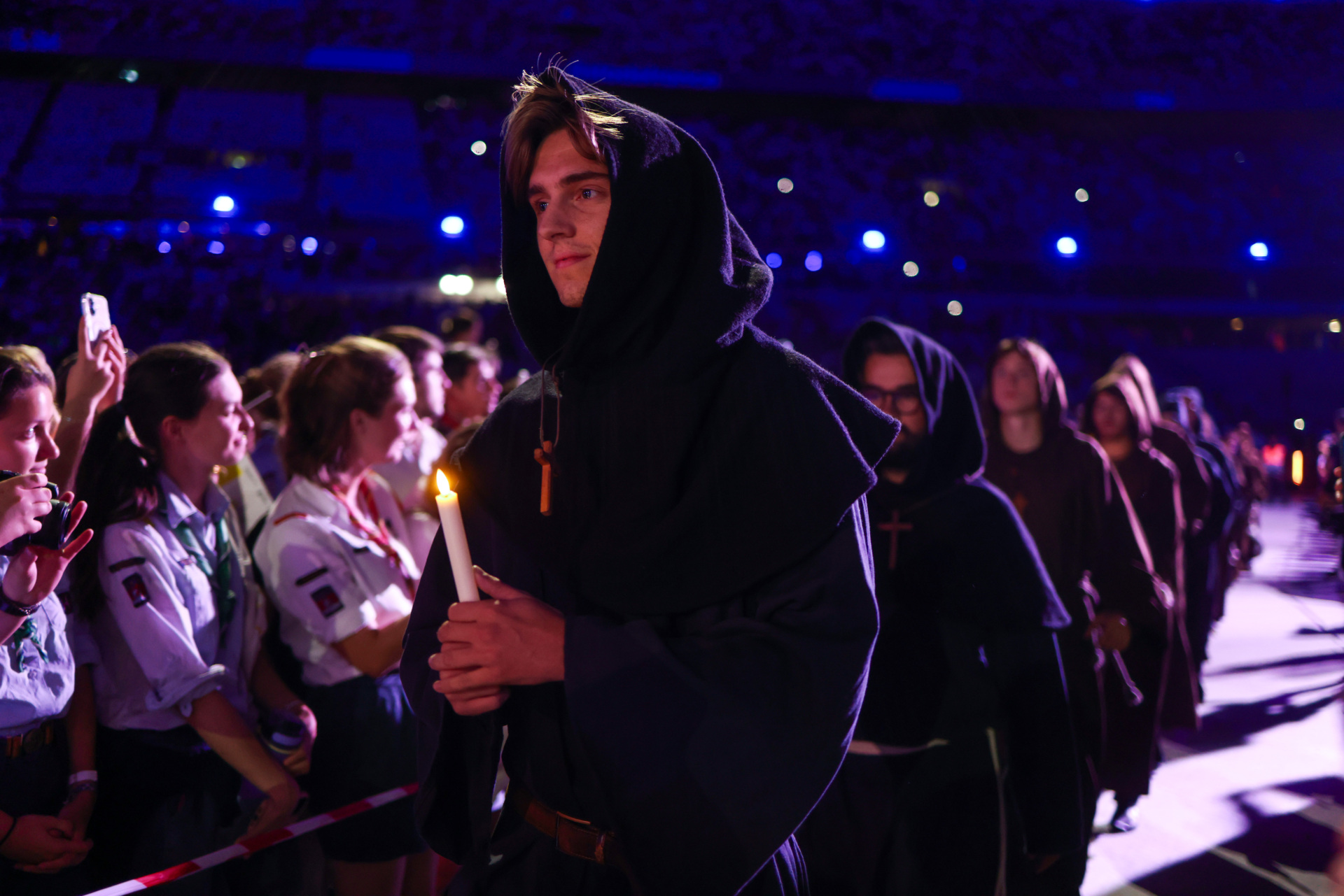 PARIS, FRANCE - SEPTEMBER 25: Faithful take part in a theatrical performance in ten scenes depicting French saints and virtues during a prayer vigil with young people at the Stade de France on September 25 in Saint-Denis, a northern suburb of Paris, France. Pope Leo XIV is making his first official visit to France from September 25-28 with stops in Paris, Lourdes, and Metz. While in Paris, the pontiff's agenda includes a meeting with French President Emmanuel Macron, a prayer service at Notre-Dame Cathedral, and an open-air mass along the Champs-Élysées, among other engagements. The trip marks the first papal visit to the European country since Benedict XVI visited in 2008. (Photo by Tom Nicholson/Getty Images)