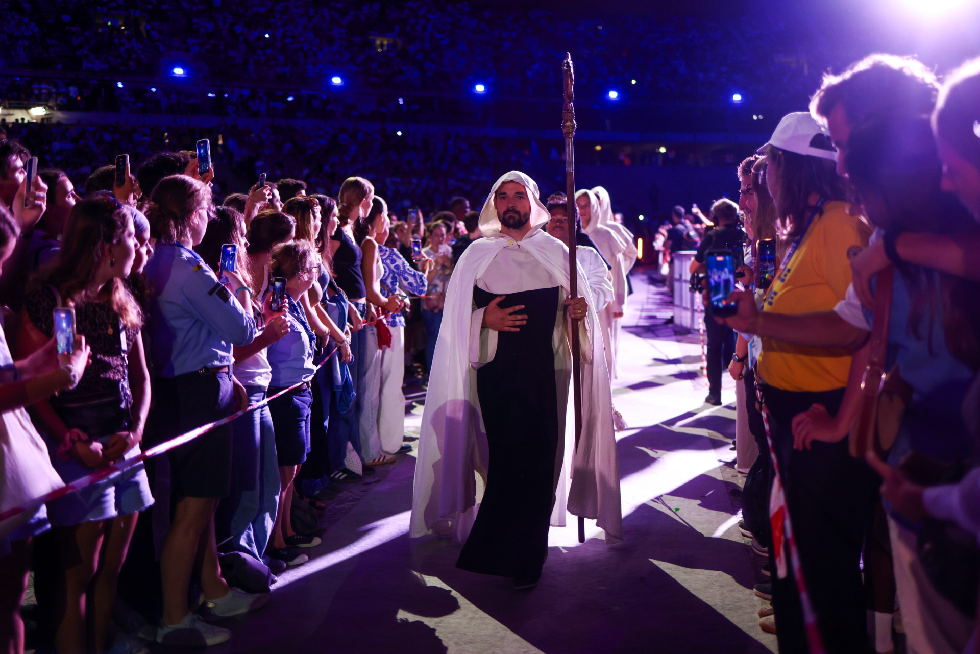 PARIS, FRANCE - SEPTEMBER 25: Faithful take part in a theatrical performance in ten scenes depicting French saints and virtues during a prayer vigil with young people at the Stade de France on September 25 in Saint-Denis, a northern suburb of Paris, France. Pope Leo XIV is making his first official visit to France from September 25-28 with stops in Paris, Lourdes, and Metz. While in Paris, the pontiff's agenda includes a meeting with French President Emmanuel Macron, a prayer service at Notre-Dame Cathedral, and an open-air mass along the Champs-Élysées, among other engagements. The trip marks the first papal visit to the European country since Benedict XVI visited in 2008. (Photo by Tom Nicholson/Getty Images)