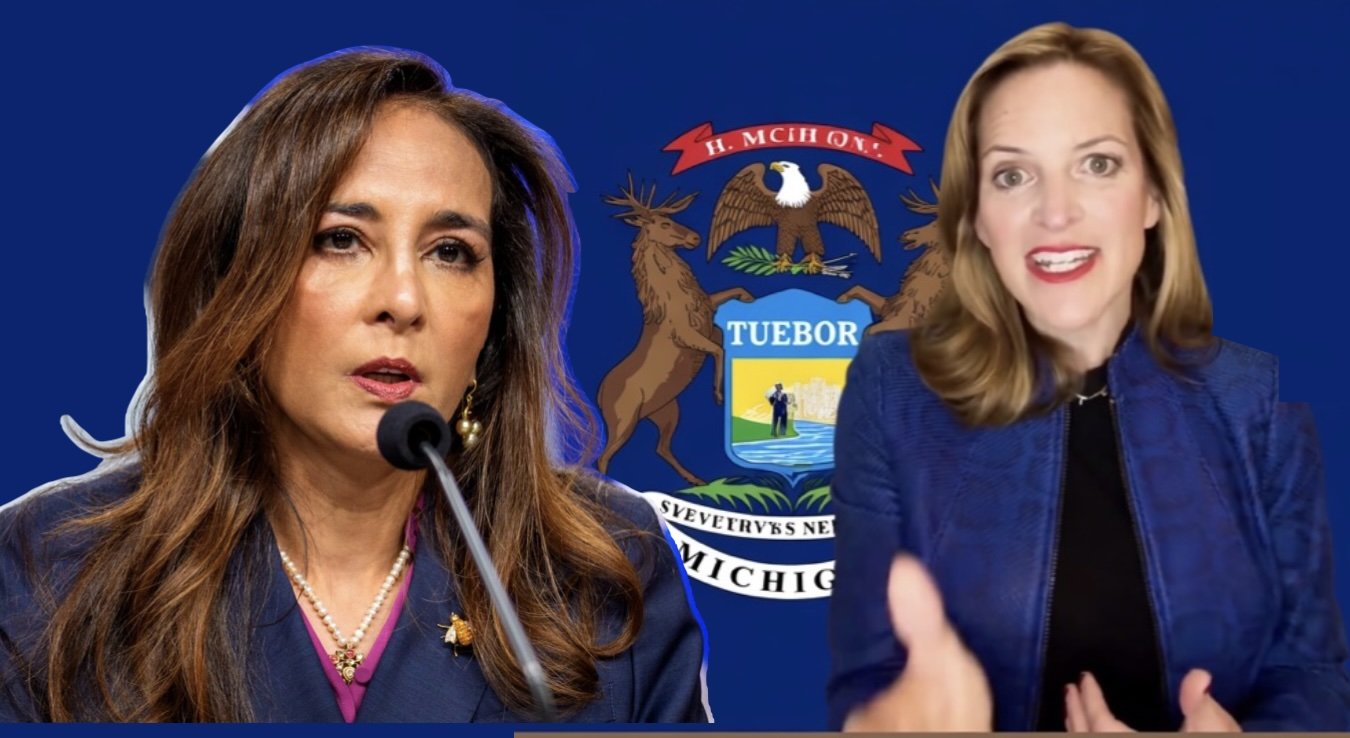 Two women speaking at a conference with Michigan's state seal in the background, highlighting political discussions and leadership in the state.