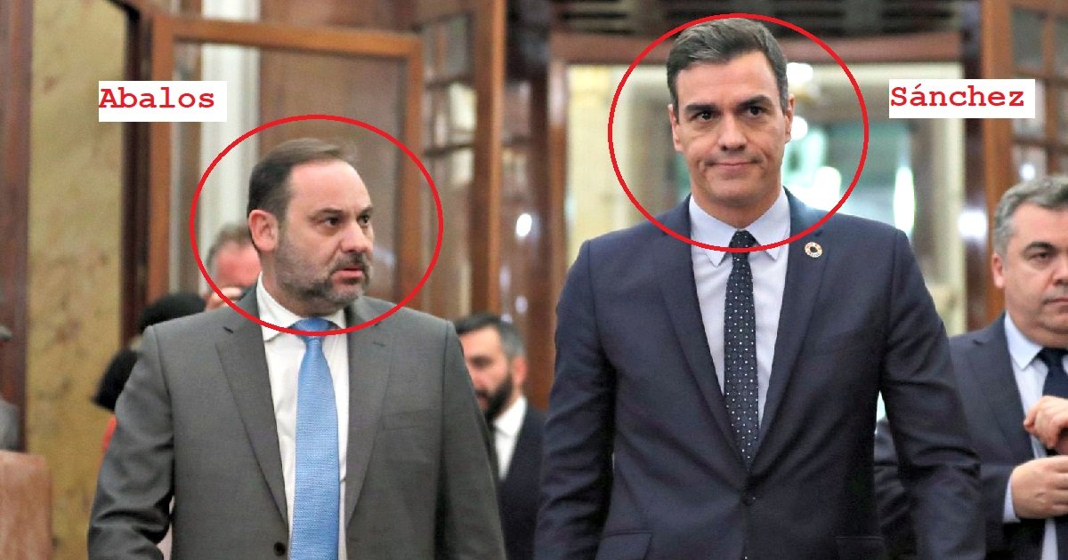 Spanish politicians Abalos and Sánchez walking together in a formal setting, discussing important matters during an official event.